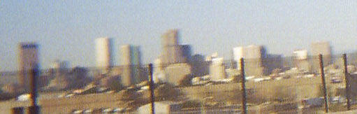 denver skyline from the car moving slowly in traffic